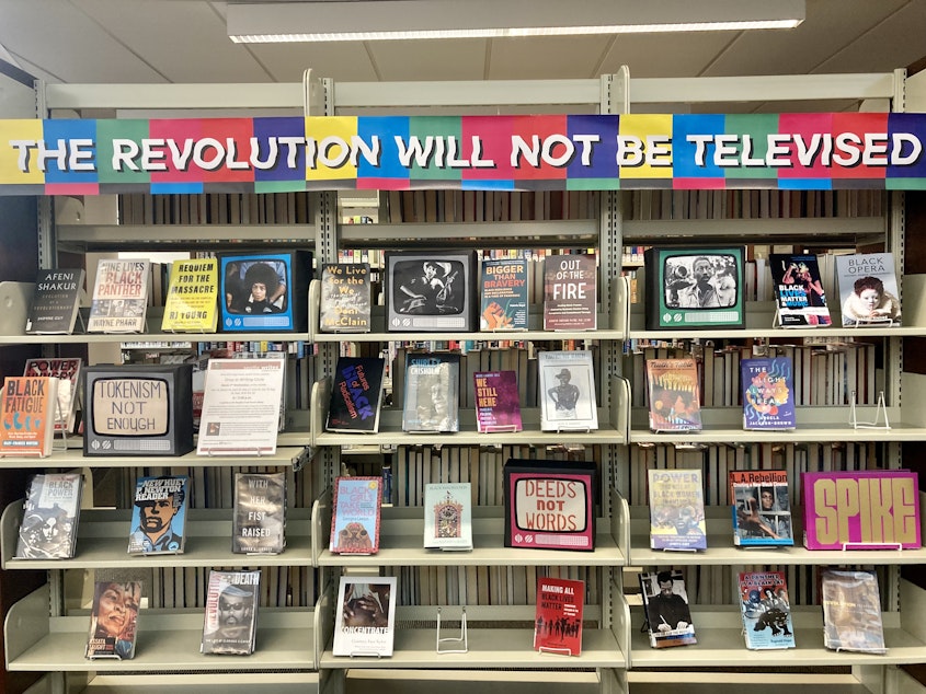 caption: A display in the Seattle Public Library's Douglass-Truth Branch highlights Black literature and history.