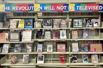 caption: A display in the Seattle Public Library's Douglass-Truth Branch highlights Black literature and history.