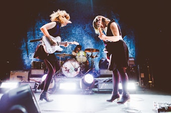 caption: The prolific feminist punk trio Sleater-Kinney formed in Olympia, Washington and signed to Sub Pop in 2005 with their seventh release, The Woods. They are currently signed to Mom+Pop Records.