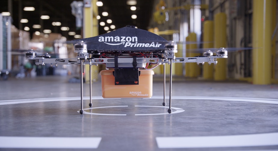 caption: This undated image provided by Amazon.com shows the so-called Prime Air unmanned aircraft project that Amazon is working on in its research and development labs.