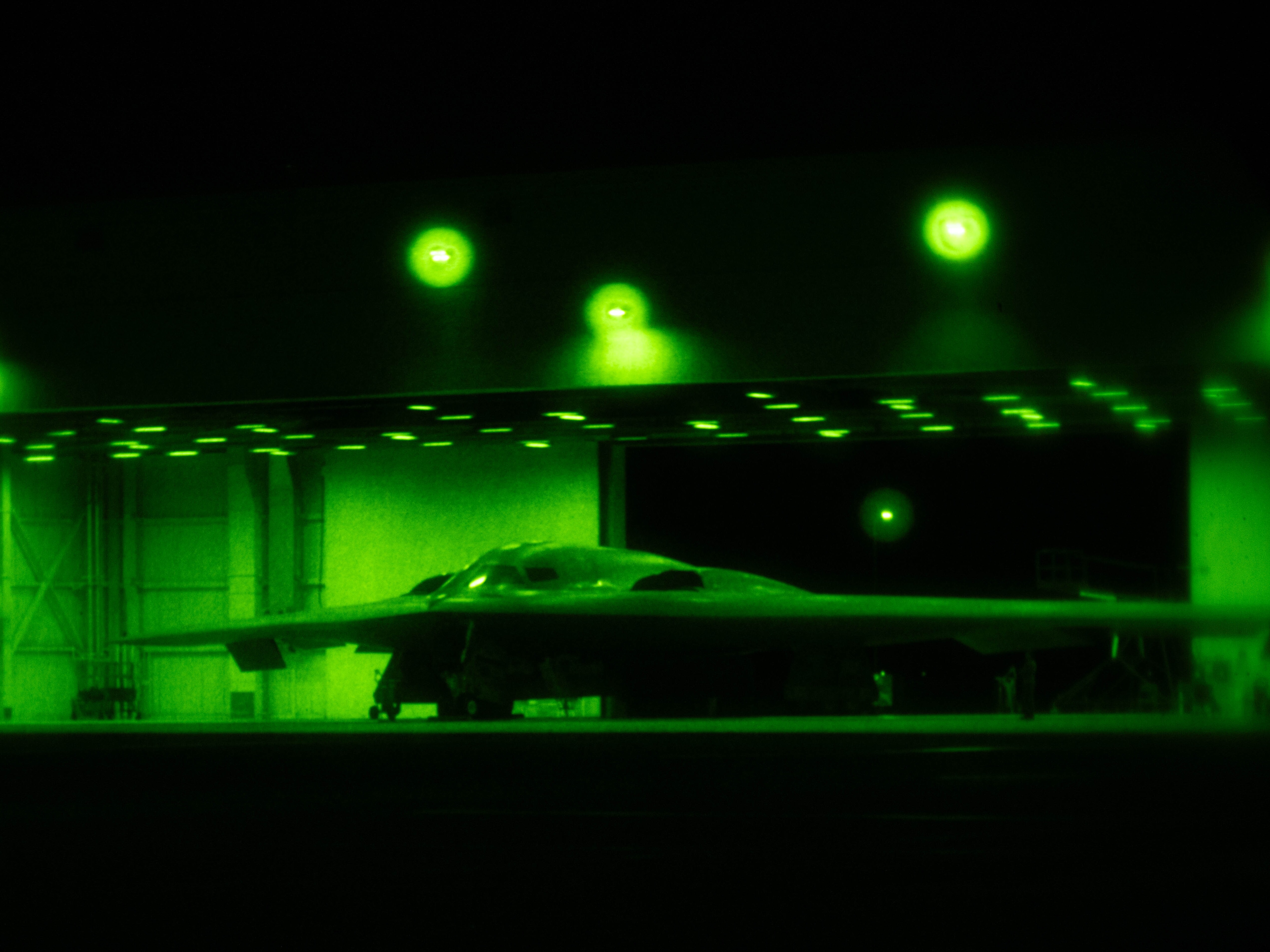 caption: A U.S. Air Force B-2 Spirit is prepared for operations ahead of "Operation Midnight Hammer" at Whiteman Air Force Base in Missouri, June 2025.