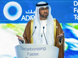 caption: Sultan al-Jaber is the president of this year's climate talks and the head of the UAE's state-run oil company. Oil companies have a big platform at the climate conference, and experts say their language is important because it can make it into policy.