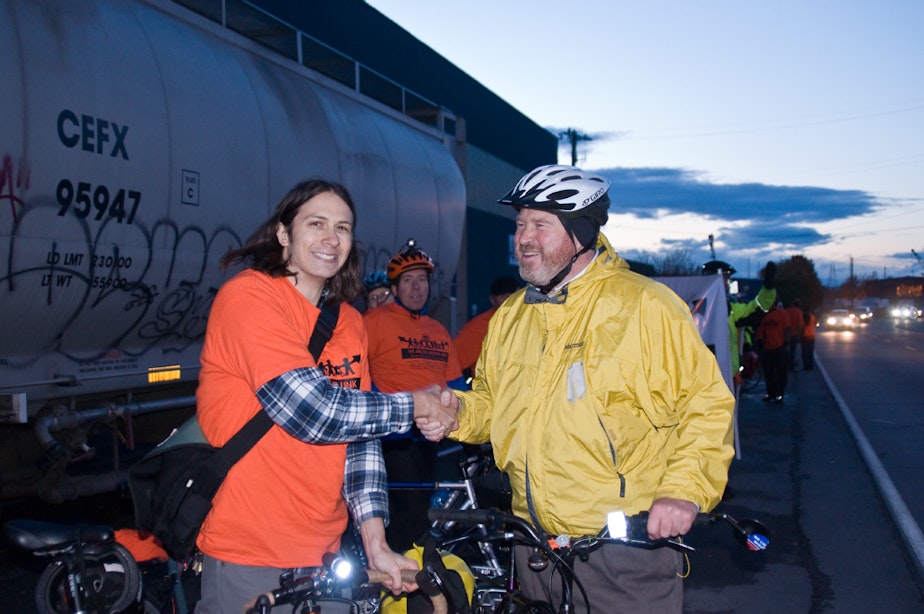 caption: Former Mayor Mike McGinn, a biker booster, shakes hands with a campaign volunteer in this 2009 file photo.