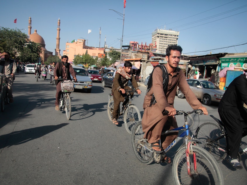 caption: Bicycles have become the only commuting option for many Afghans, who are often unable to afford a ride in a bus or a shared cab as the economy has unraveled under Taliban rule. But the conservative Taliban culture means that women are missing from the ranks of these new riders.