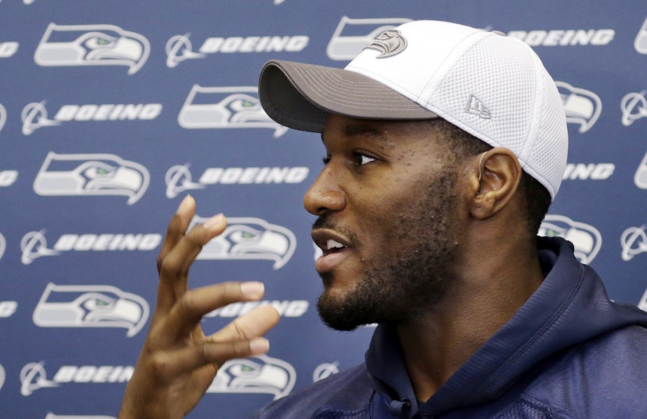 caption: Seattle Seahawks' Derrick Coleman speaks with members of the media about how he can read lips, before an NFL football practice Thursday, Jan. 16, 2014, in Renton, Wash.