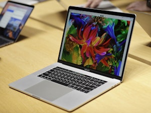 caption: A MacBook laptop computer shown in 2016.