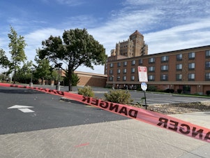caption: The historic Marcus Whitman in Walla Walla is taped off and shut down until officials can learn more about the plume of gasoline underneath some of downtown.<br/>