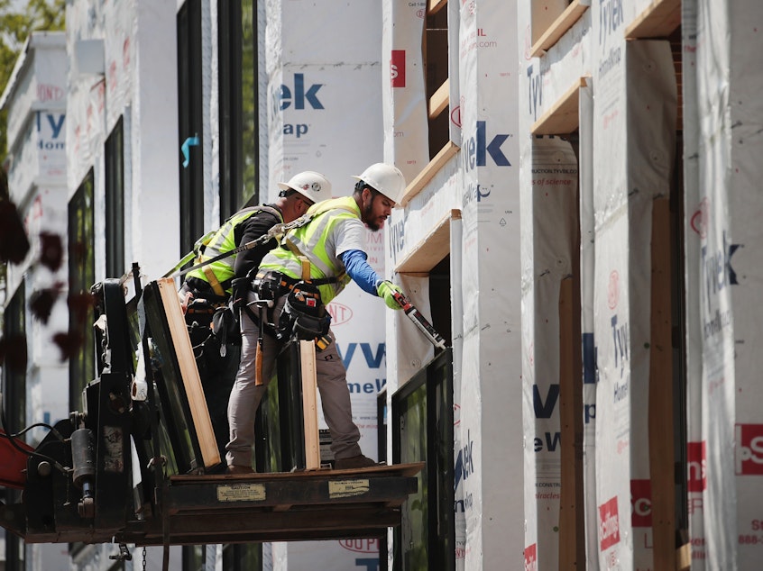 caption: Unusually warm weather contributed to a surge in construction last month, with 44,000 jobs added.