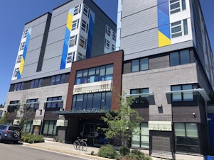 caption: Hobson Place in Rainier Valley contains 177 units of permanent supportive housing. A mother says she wants the staff to do more to stem illicit drug use, which has caused her son's mental health to deteriorate. 