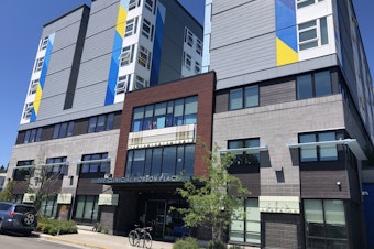 caption: Hobson Place in Rainier Valley contains 177 units of permanent supportive housing. A mother says she wants the staff to do more to stem illicit drug use, which has caused her son's mental health to deteriorate. 