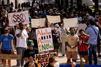 caption: Abortion rights activists rally at the Texas State Capitol on Sept. 11, 2021 in Austin.