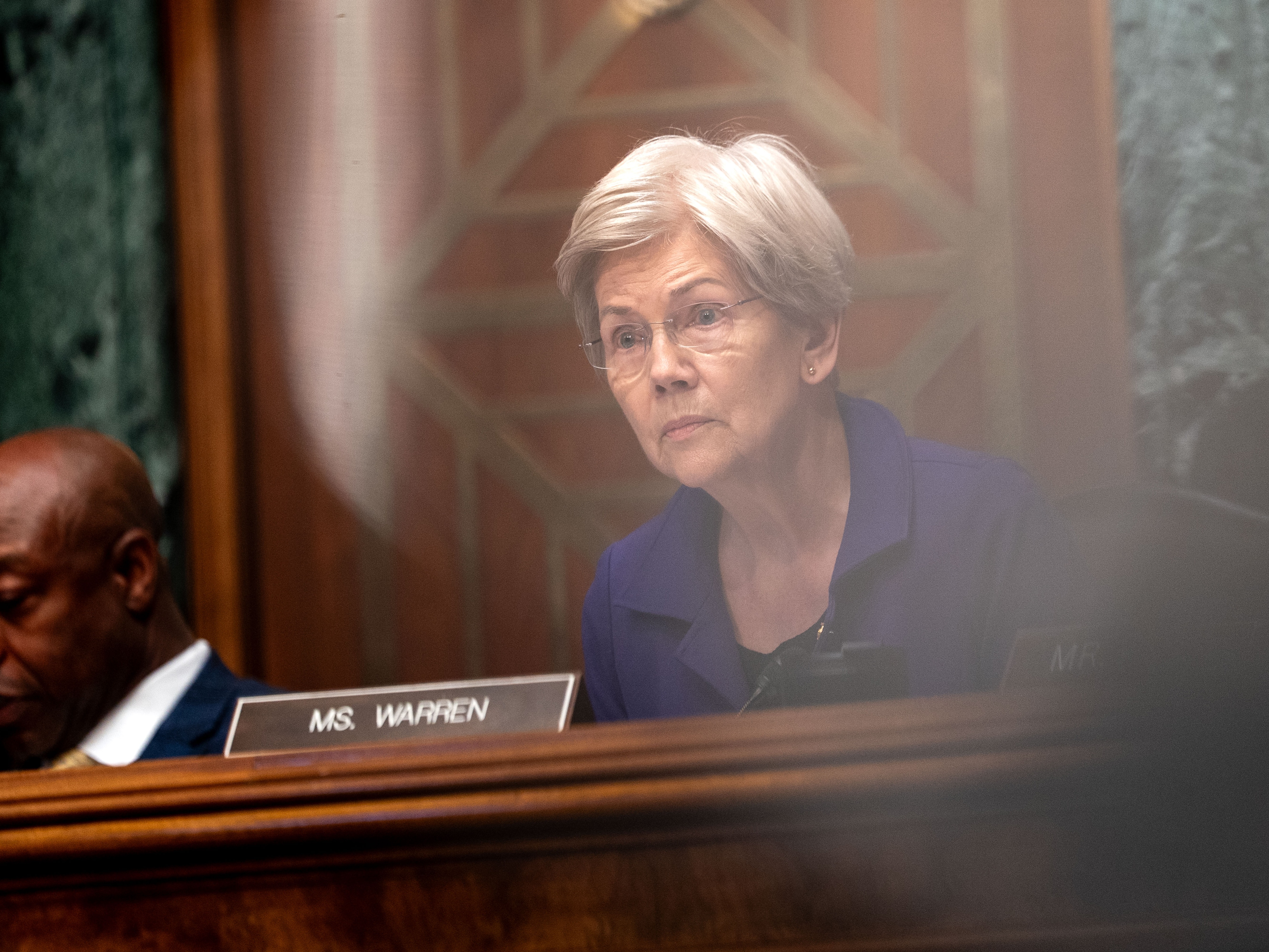 caption: Ranking member Sen. Elizabeth Warren (D-MA) before the Senate Committee on Banking, Housing, and Urban Affairs during a hearing on Capitol Hill on June 25, 2025, in Washington, D.C.