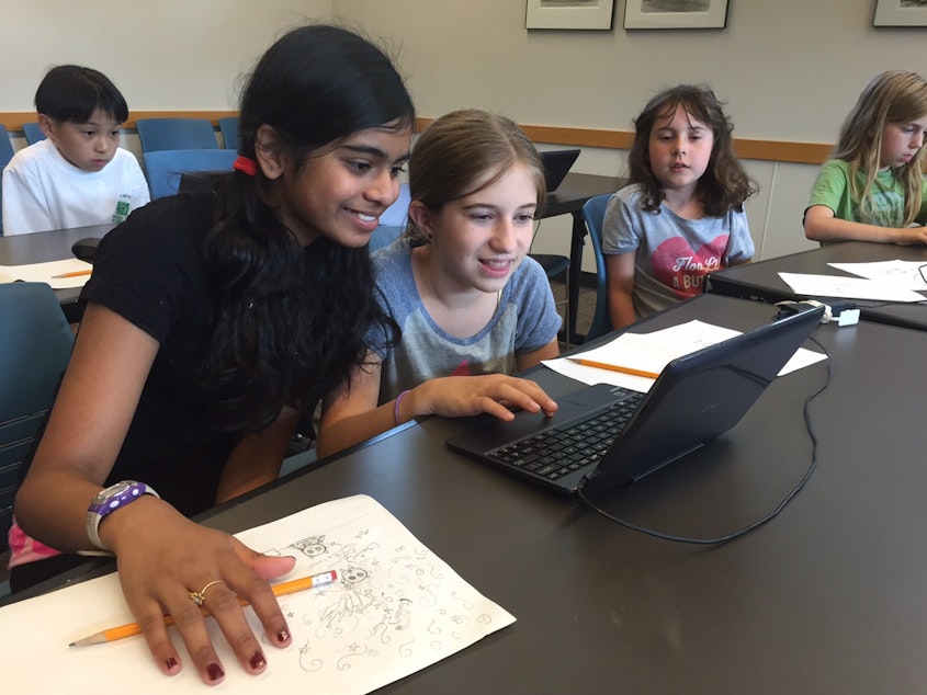 caption: Eleven-year-olds Ahana Roy and Lucy Thackray in a video game coding class at Seattle Public Library's Northeast Branch.