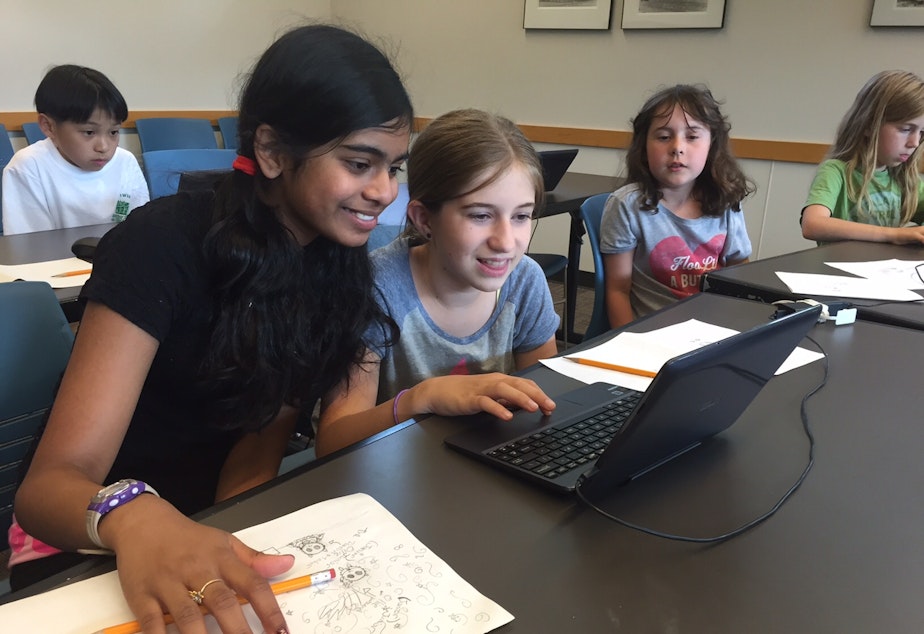 caption: Eleven-year-olds Ahana Roy and Lucy Thackray in a video game coding class at Seattle Public Library's Northeast Branch.