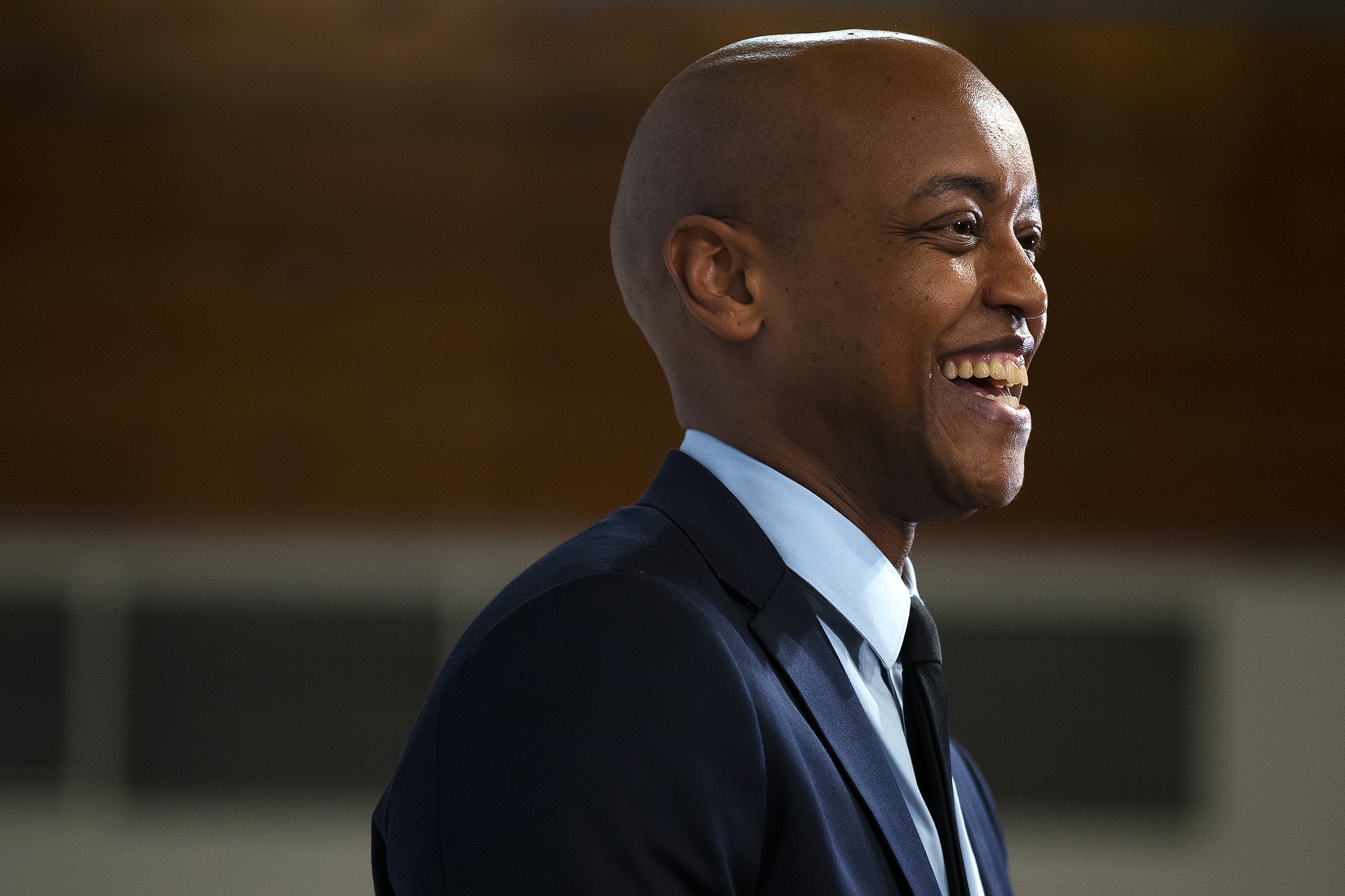 caption: Executive-elect Girmay Zahilay laughs while speaking to an audience before being sworn in as King County Executive on Tuesday, Nov. 25, 2025, at the New Holly Gathering Hall.