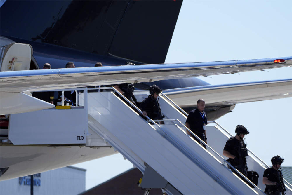 caption: Members of the U.S. Secret Service counter assault team arrive on the plane with Republican presidential nominee former President Donald Trump for a campaign rally at Wilmington International Airport, Saturday, Sept. 21, 2024. (Alex Brandon/AP)