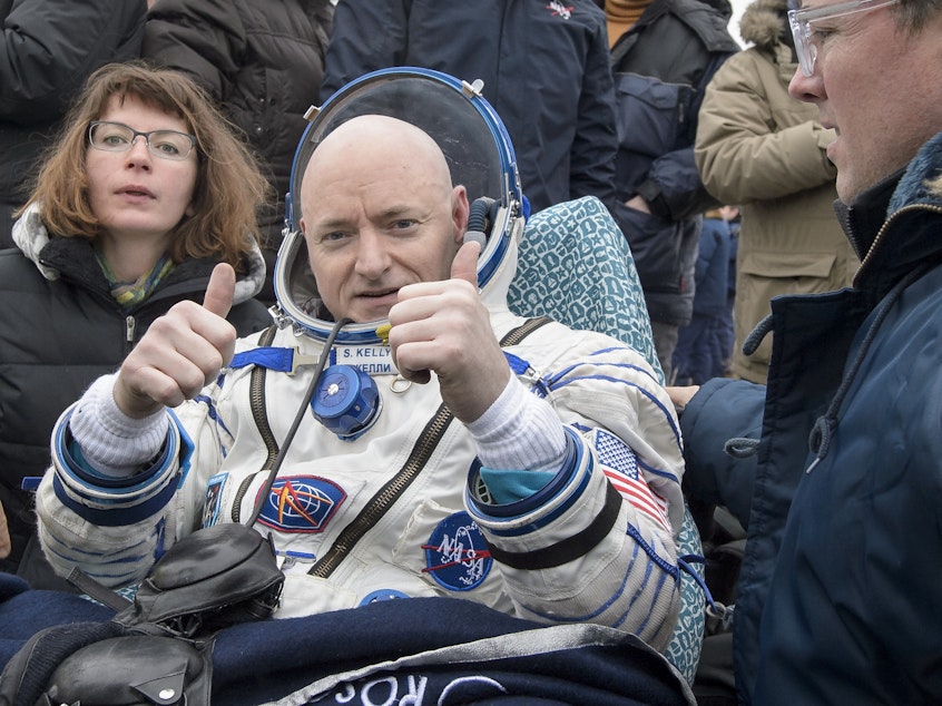 caption: Former NASA astronaut Scott Kelly, seen after he completed a year-long mission in space, in 2016, is one of 16 researchers selected for the study.