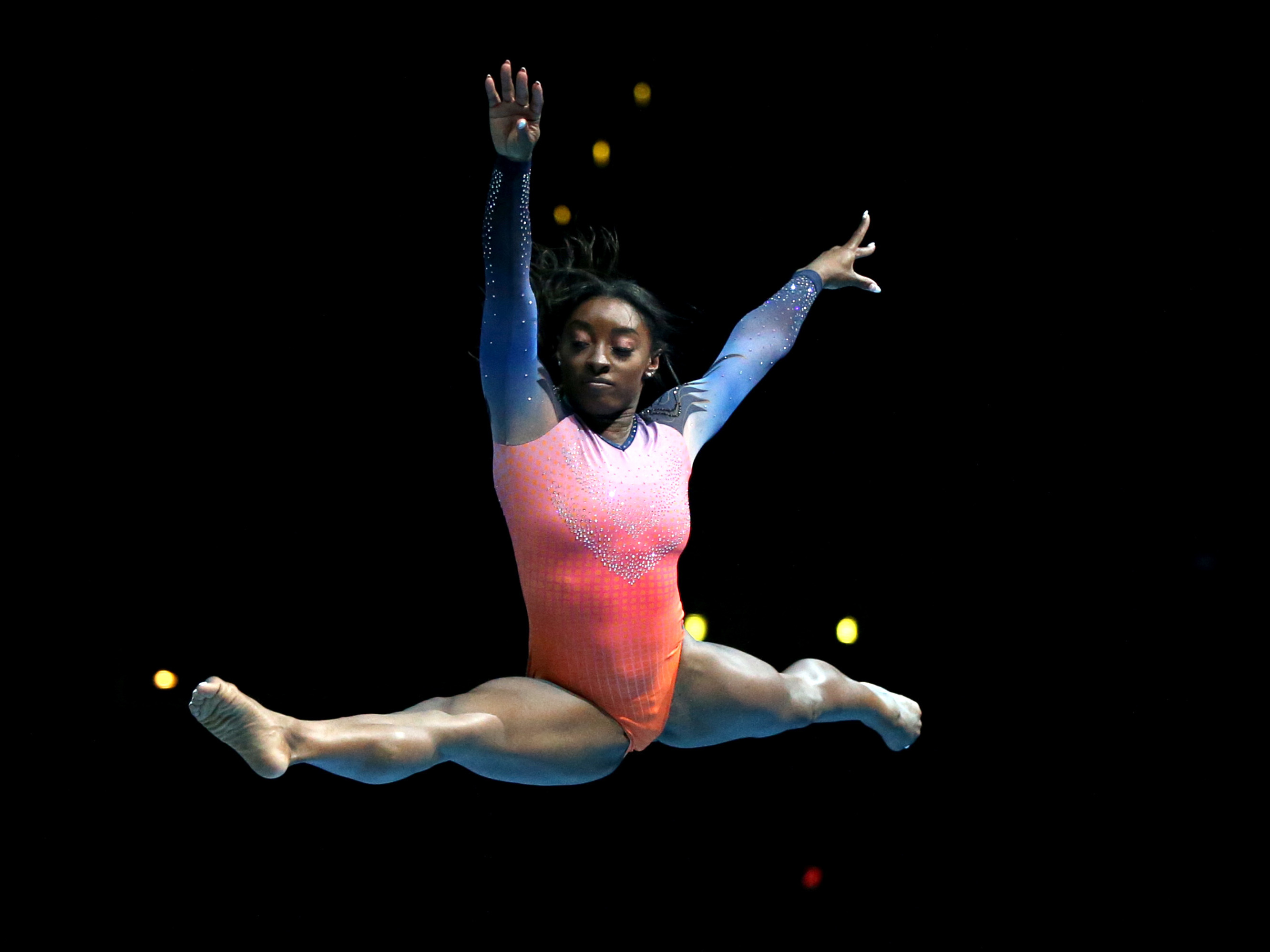 caption: Simone Biles performs during the Gold Over America Tour. In an interview, she says she is still not performing twists.