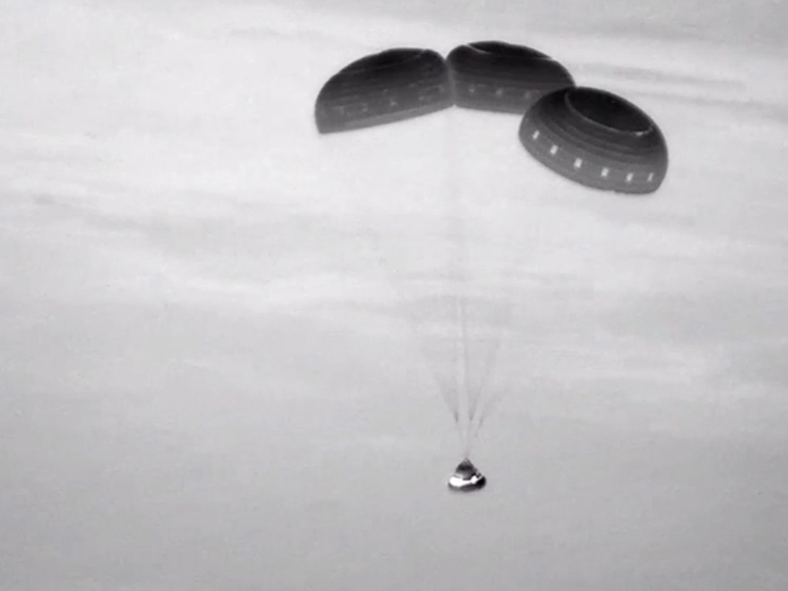caption:  This image, taken from NASA video, shows the Boeing Starliner capsule coming down through the darkness over New Mexico. 