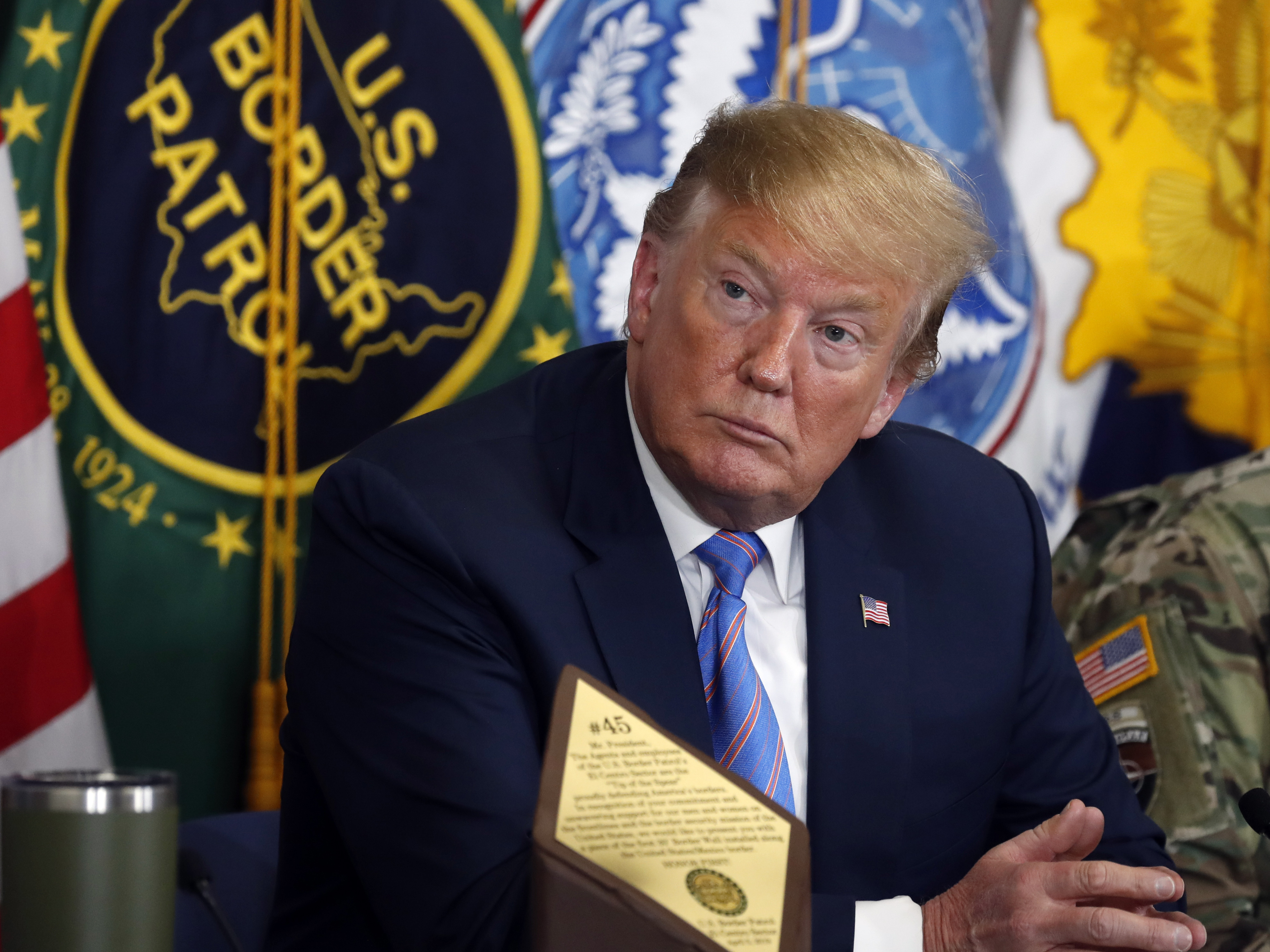 caption: President Trump participates in a roundtable on immigration and border security at the U.S. Border Patrol Calexico Station in Calexico, Calif., on April 5.