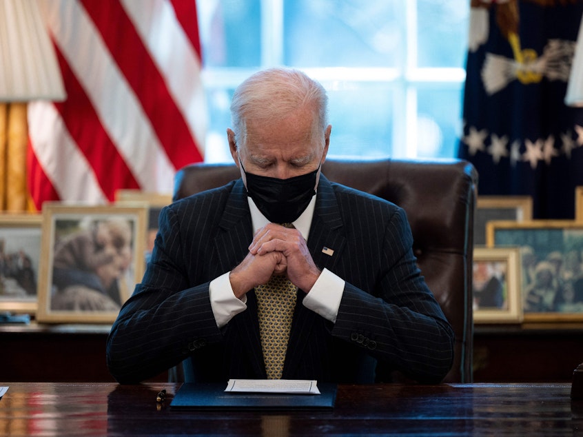 caption: President Biden is pictured in the Oval Office on March 30. On Thursday, he is expected to announce executive action related to gun safety.