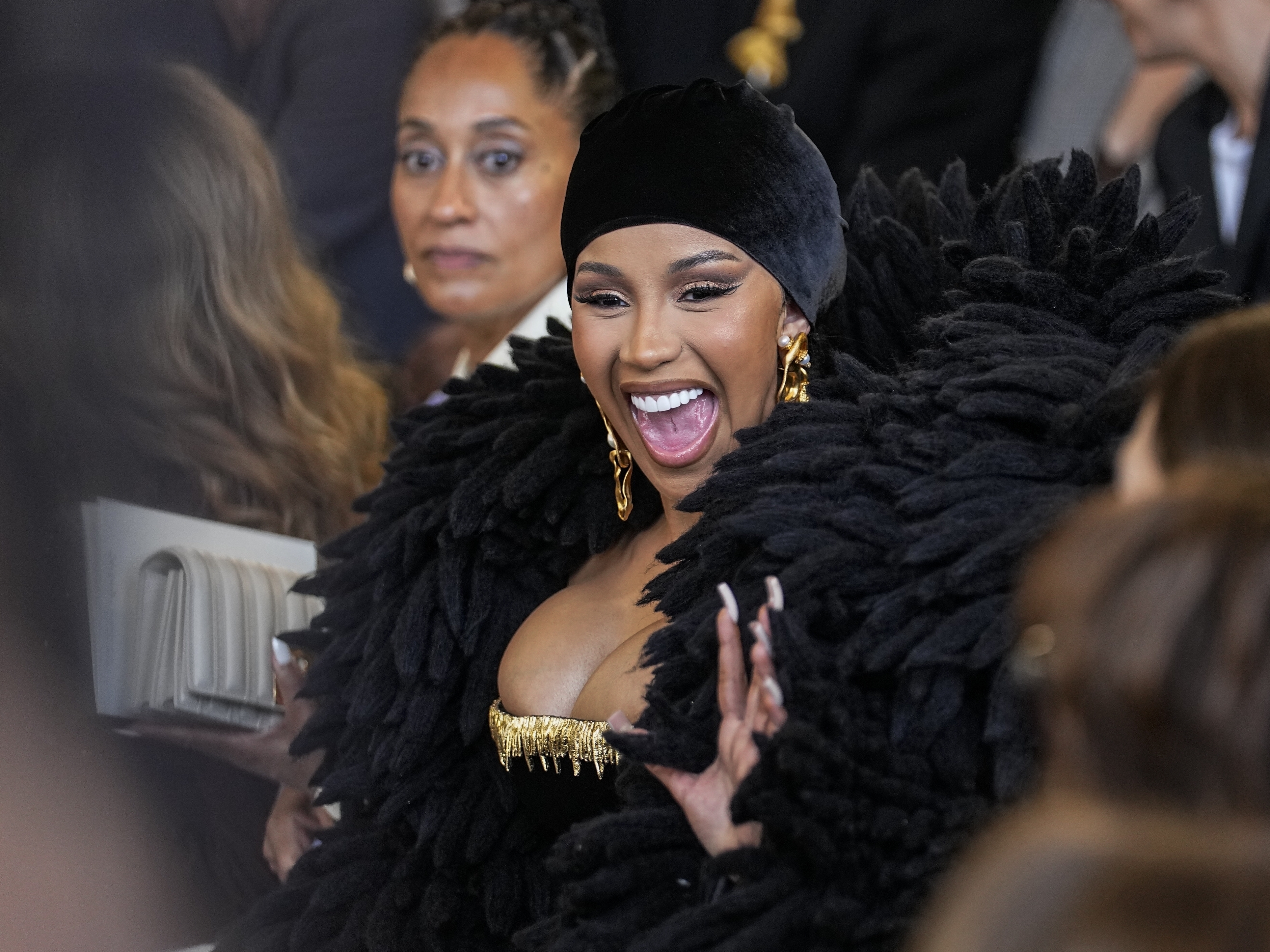 caption: Cardi B, seen here on July 3, was performing in Las Vegas when a fan threw a drink at her. Concertgoers have thrown objects at musical artists in several highly publicized instances in the past few months.