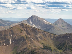 caption: First Peoples Mountain is the new name for a peak formerly named after a white man who helped lead an attack that left more than 170 Native Americans dead.