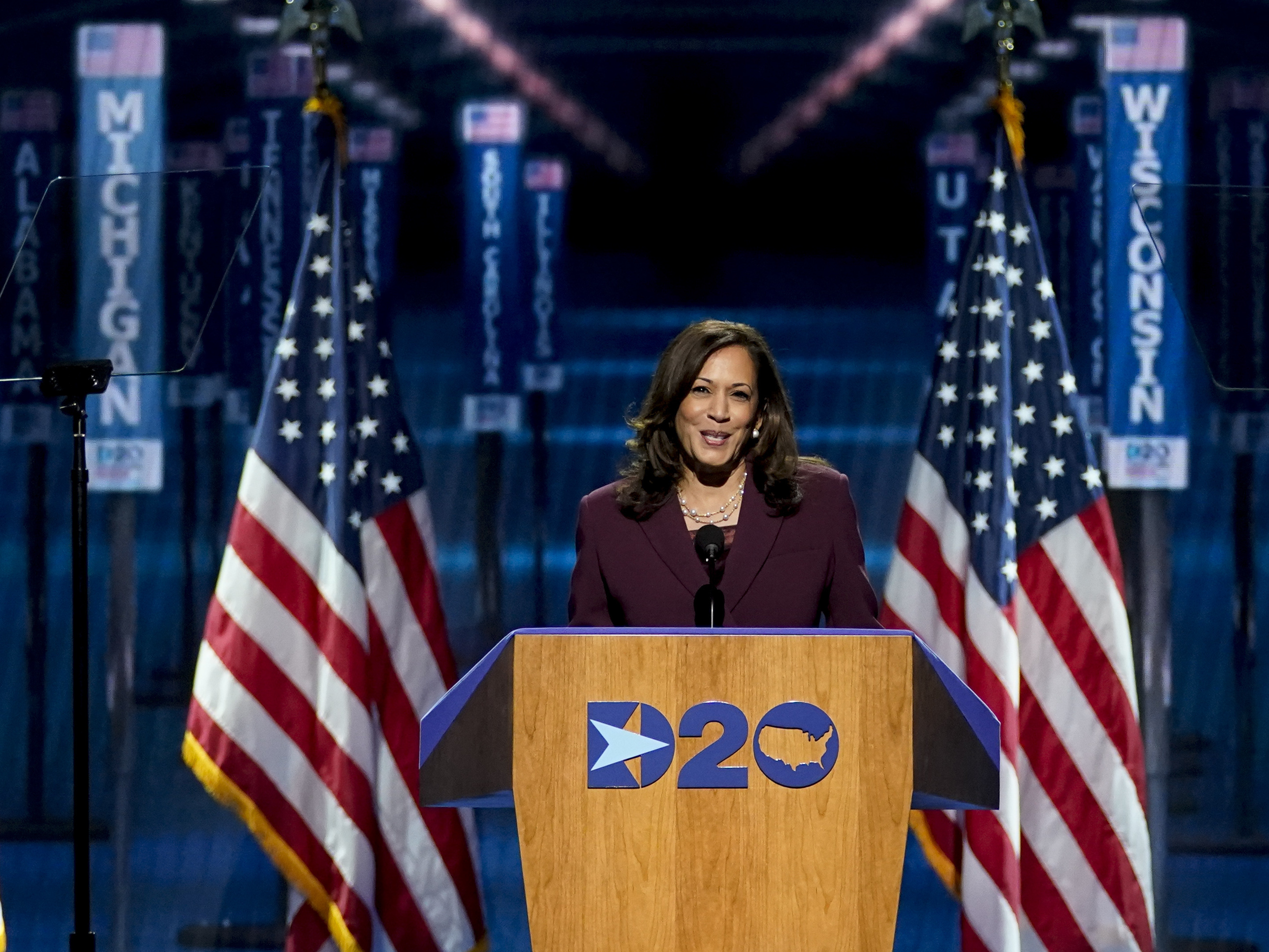 caption: Democratic vice presidential candidate Sen. Kamala Harris, D-Calif., speaks in Wilmington, Del., during Night 3 of the Democratic National Convention. She spoke about her upbringing and her family and her background as a prosecutor.