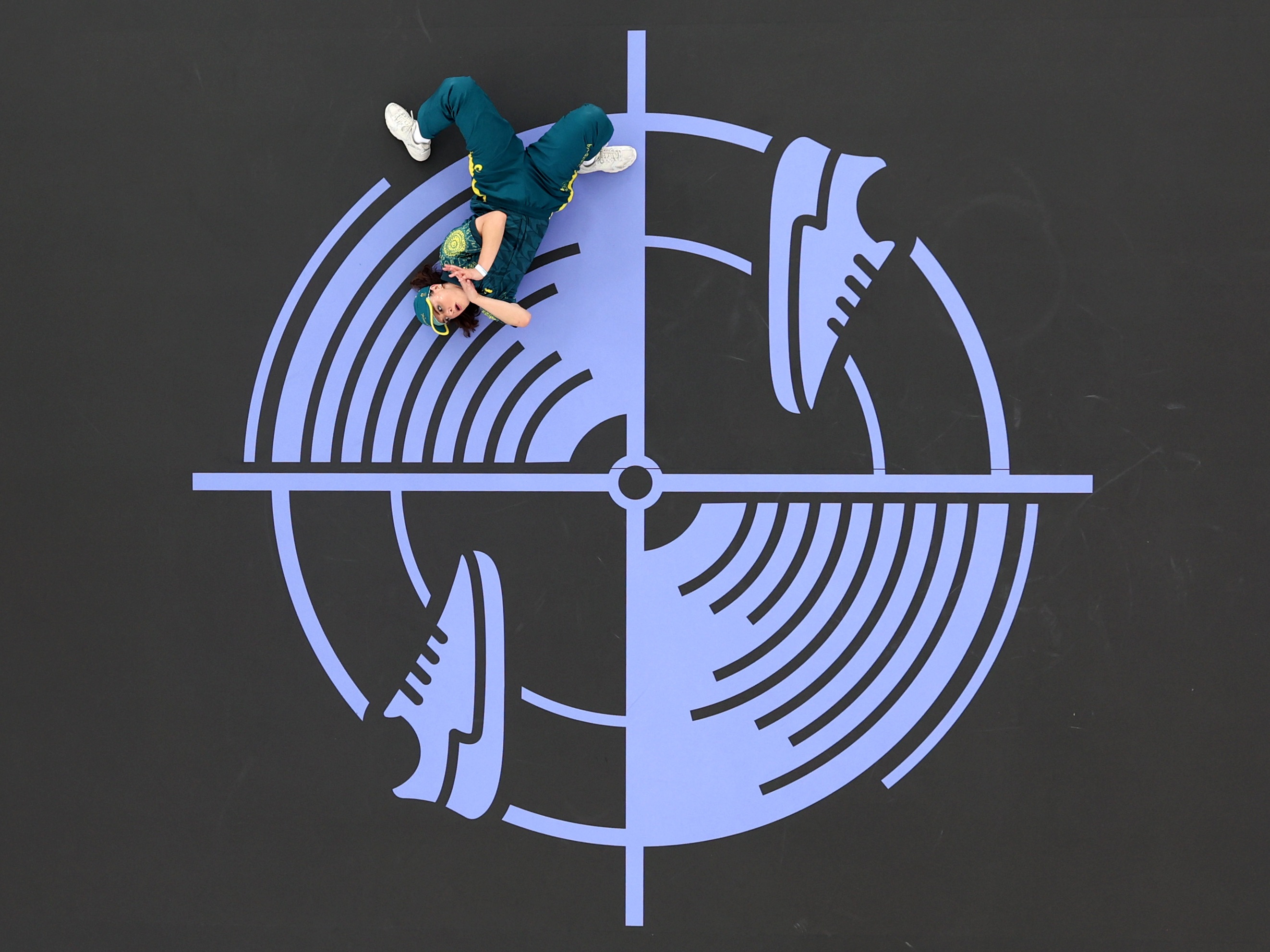 caption: B-girl Raygun of Team Australia was targeted by haters and conspiracy theorists after she broke out a raft of unorthodox moves during the Breaking B-Girls competition at the Paris Olympics at the Place de la Concorde venue.