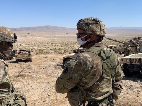 caption: National Guard soldiers take part in desert training at Fort Irwin, Calif.
