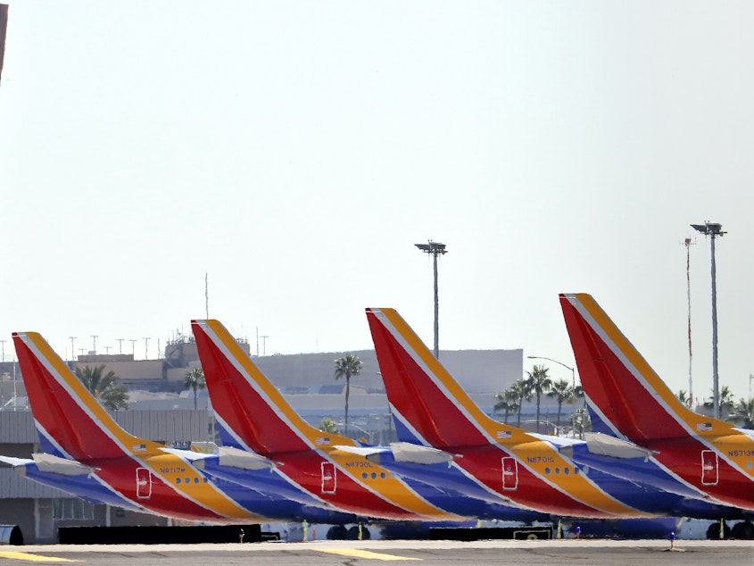 caption: Boeing 737 Max jets are grounded at Sky Harbor International Airport in Phoenix on March 14.
