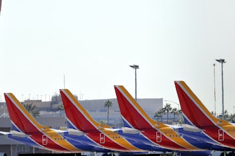 caption: Boeing 737 Max jets are grounded at Sky Harbor International Airport in Phoenix on March 14.