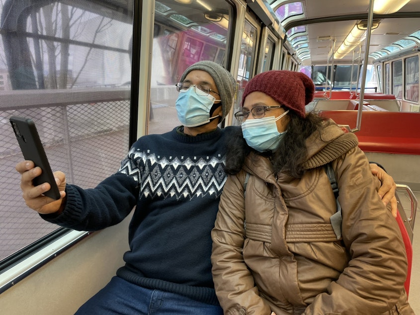 caption: Archana and Vikrand Mahajan take a selfie on their first monorail ride in December, 2021
