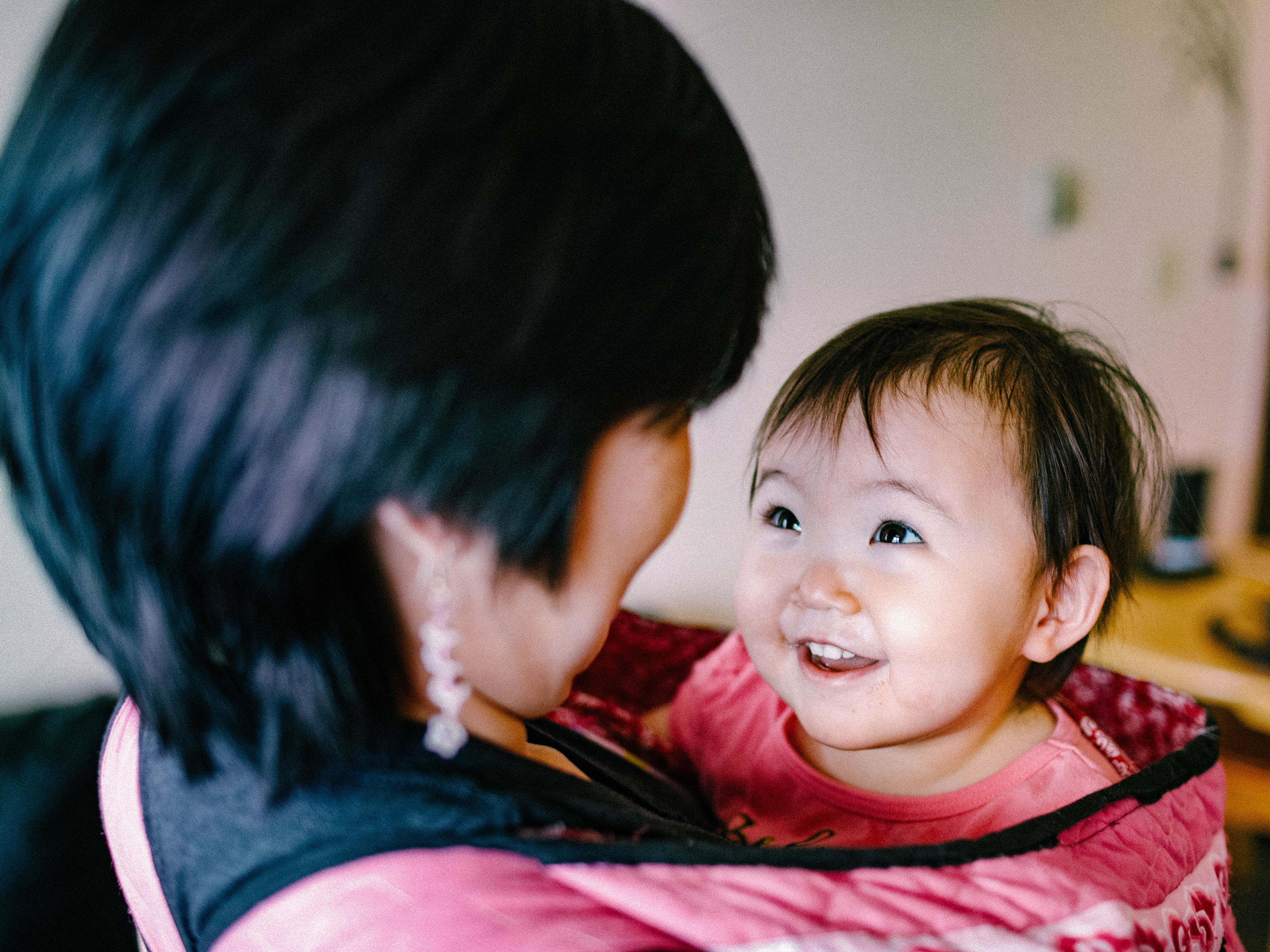 caption: Inuit parents value the playful side of kids, even when disciplining them. Above: Maata Jaw and her daughter.