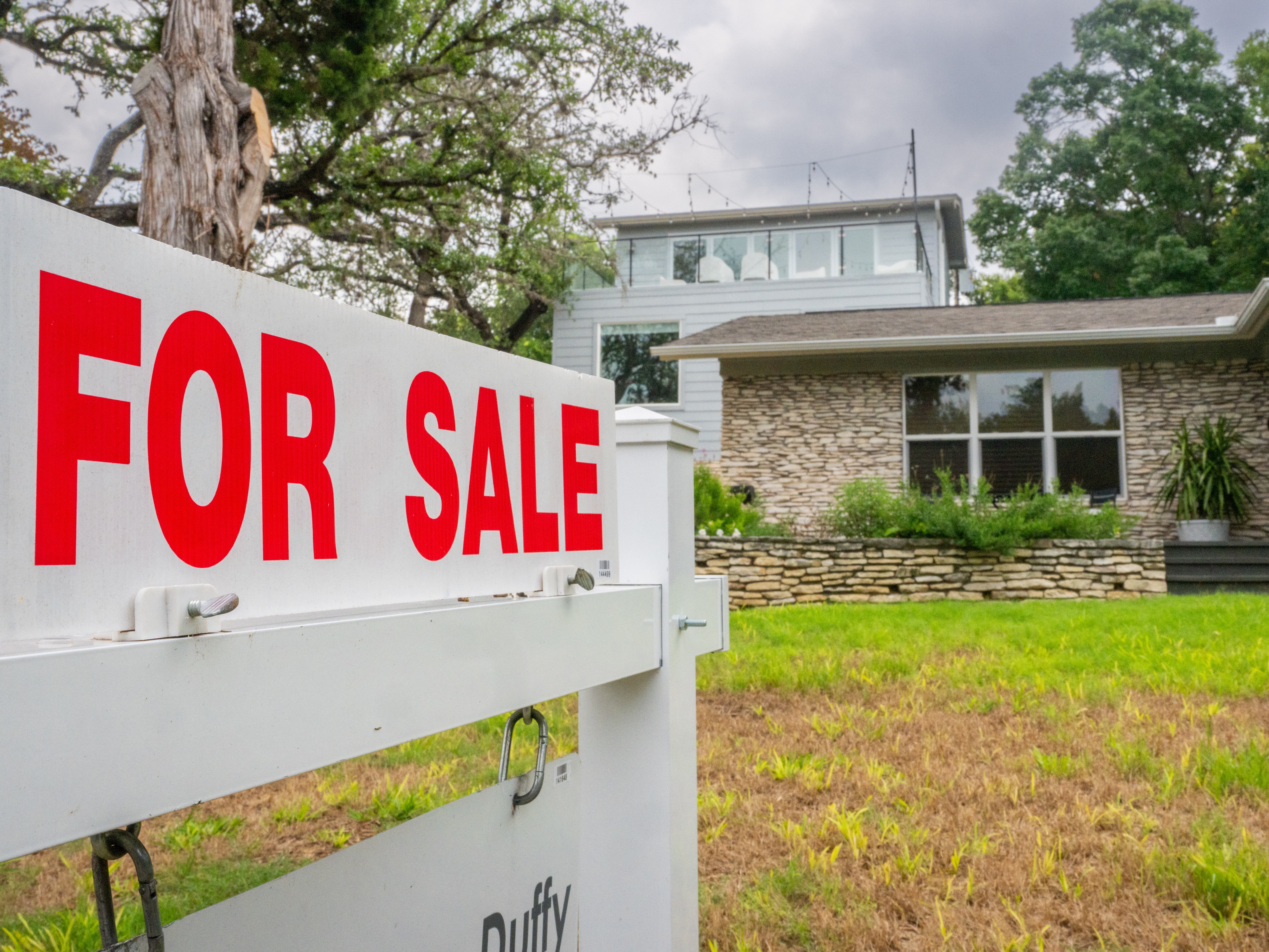 caption: Mortgage rates hit 7% for the first time since May, marking another challenge for prospective homebuyers.