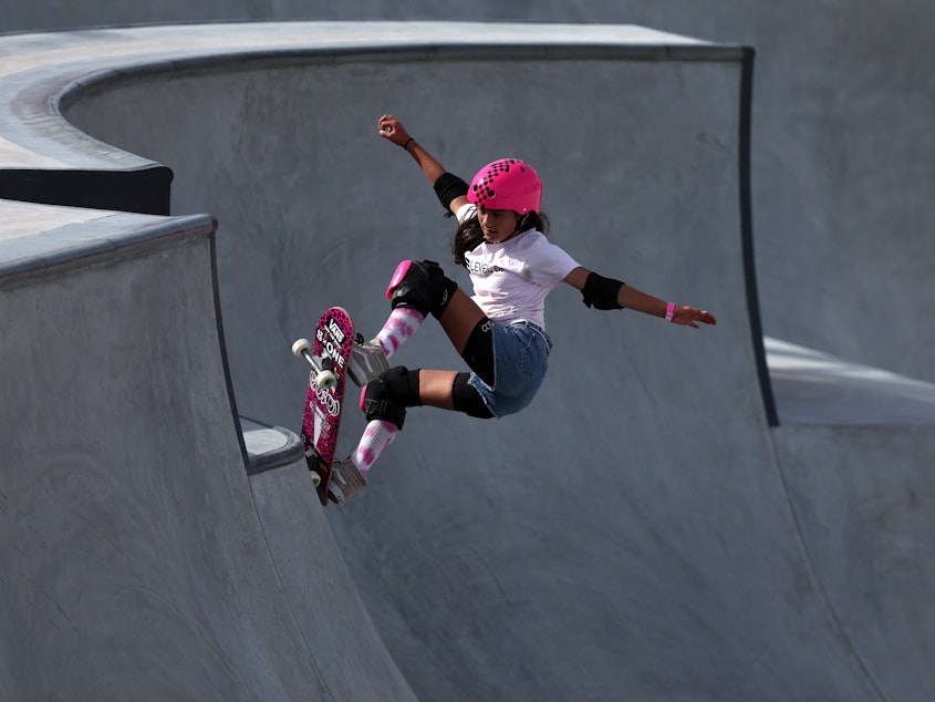 caption: Arisa Trew, the recent record breaker for the first girl to complete a 720 in competition, during the Women's Park qualifiers of the Sharjah Skateboarding Street and Park World Championships in 2023.
