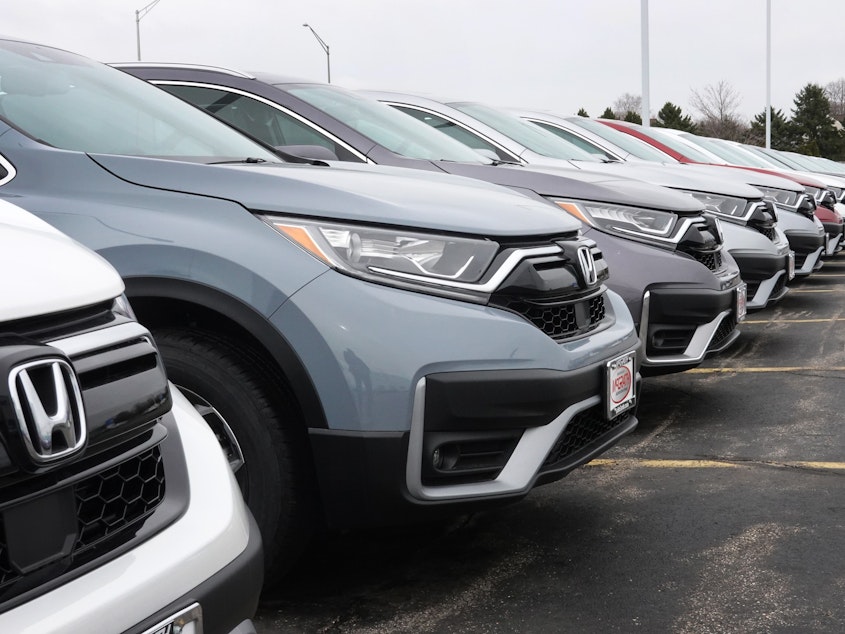 caption: Cars sit on the lot at a Honda dealership on March 25, 2021, in Elgin, Ill. Many 2020 to 2022 models are affected by a new recall.
