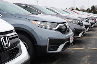 caption: Cars sit on the lot at a Honda dealership on March 25, 2021, in Elgin, Ill. Many 2020 to 2022 models are affected by a new recall.