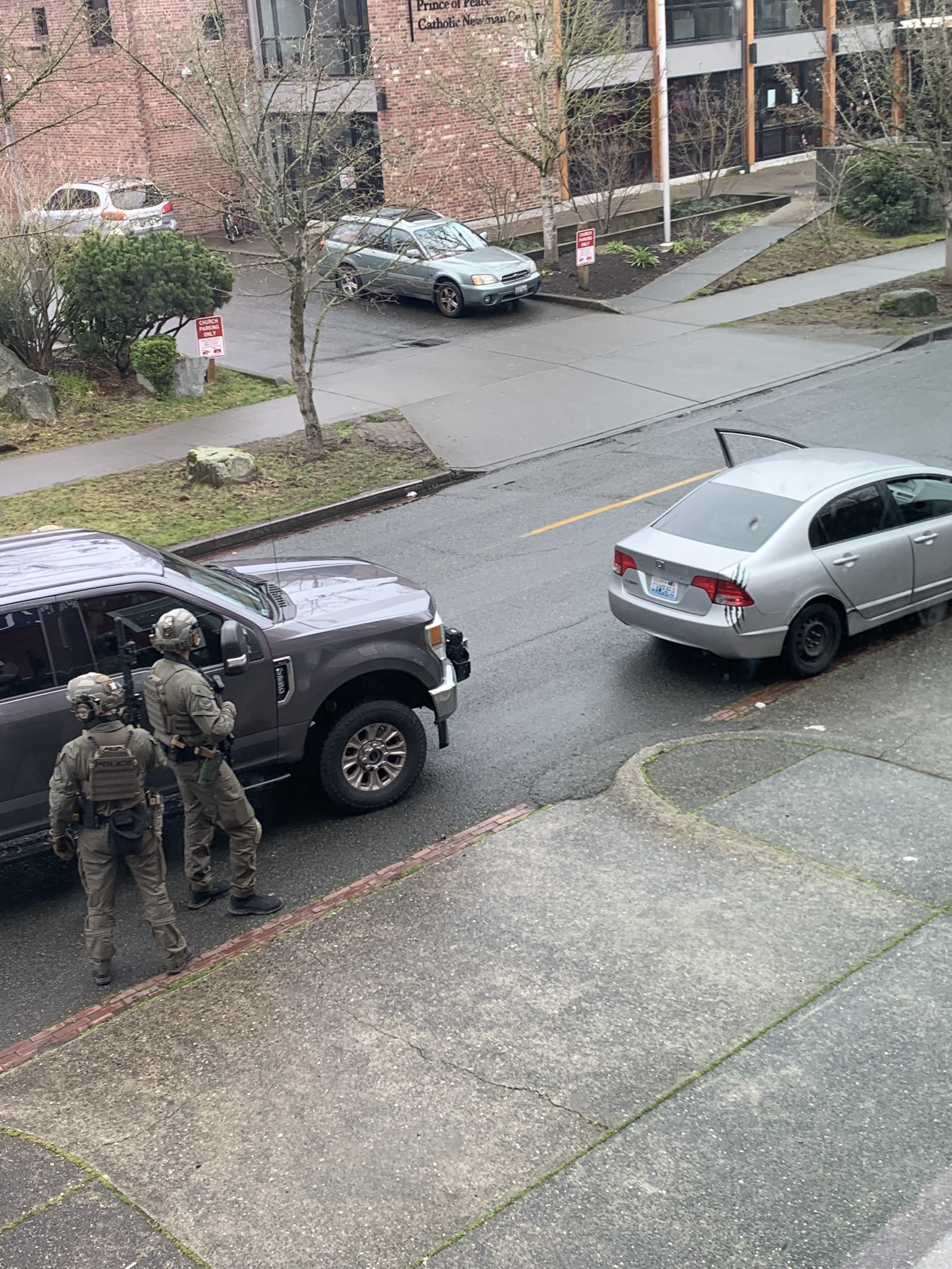 caption: Images from the arrest Tuesday of a pregnant Venezuelan woman and her baby near the campus of the University of Washington in Seattle.