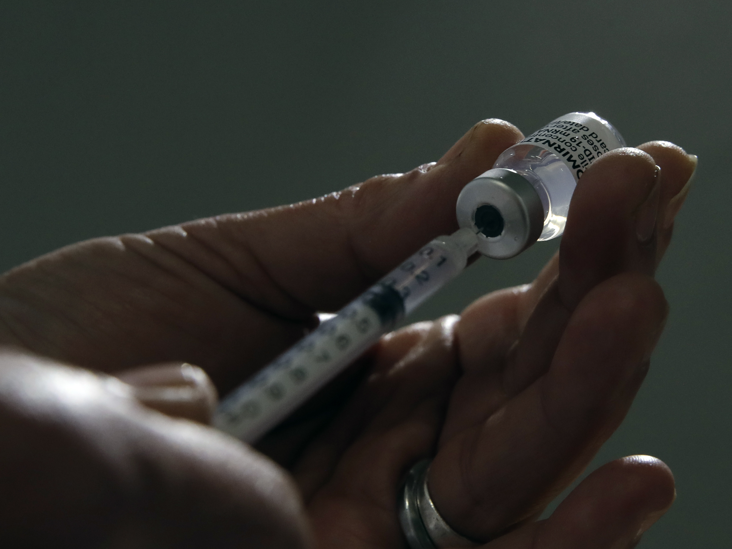 caption: The CDC and the FDA say that fully vaccinated Americans do not currently need a booster dose of a coronavirus vaccine.