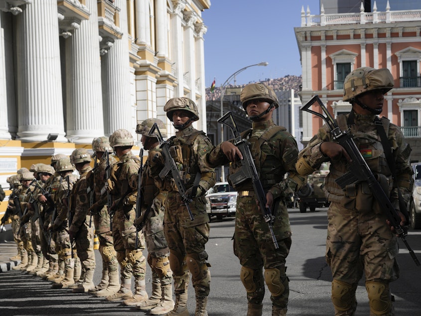 caption: Soldiers block the street in front of the presidential palace (right) and the Legislative Assembly (left) in Plaza Murillo in La Paz, Bolivia, on Wednesday.