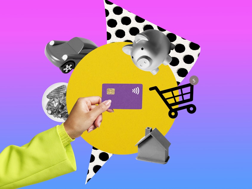 Conceptual image of woman managing her spending. She holds a purple credit card in her hand and different objects float around it, a piggy bank, a shopping card, a car, a plate of food and a house.