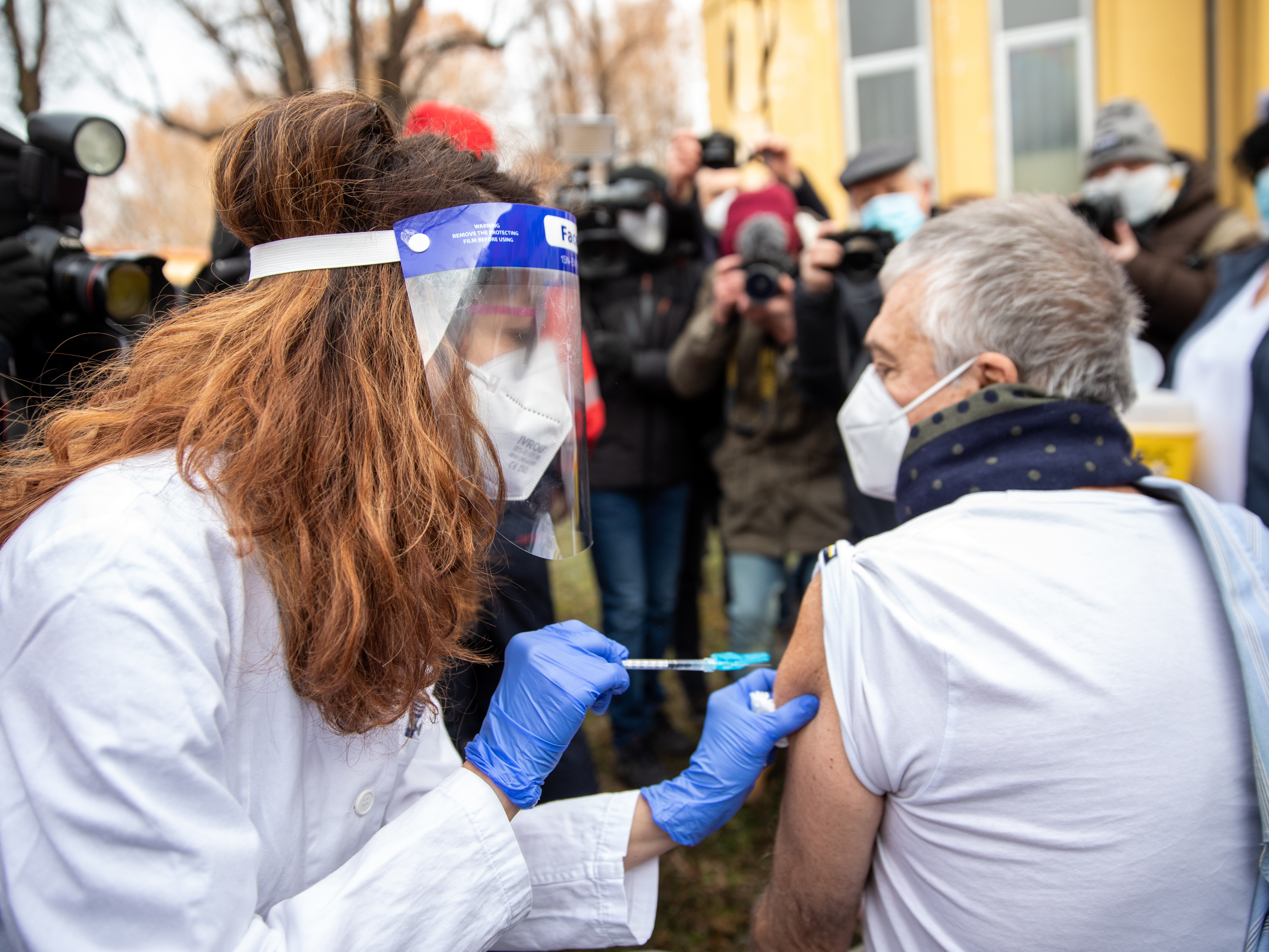 caption: A person receives Pfizer's coronavirus vaccine at the Amedeo di Savoia Hospital, in Turin, Italy, on Dec. 27, 2020. Nations across Europe began their COVID-19 vaccination effort on Sunday.