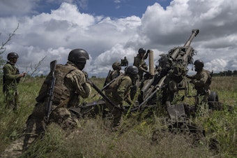 caption: Ukrainian servicemen prepare to fire at Russian positions from a U.S.-supplied M777 howitzer in Kharkiv region, Ukraine, July 14, 2022.