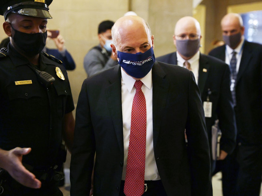 caption: U.S. Postmaster General Louis Dejoy arrives at a meeting at the office of Speaker of the House Nancy Pelosi at the U.S. Capitol on August 5, 2020.