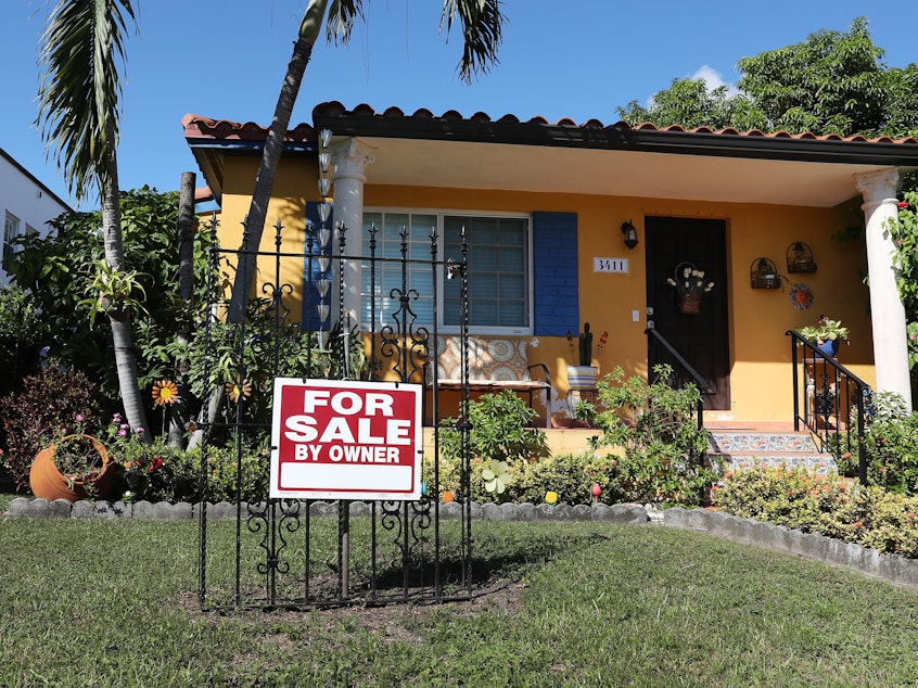 caption: A For Sale sign is seen in front of a home in Miami. FHA loans are used by many minority, lower income, and first-time homebuyers because the low down payments make homeownership more affordable. But this demographic is more likely to be hurt financially during the pandemic and many FHA borrowers are skipping mortgage payments.