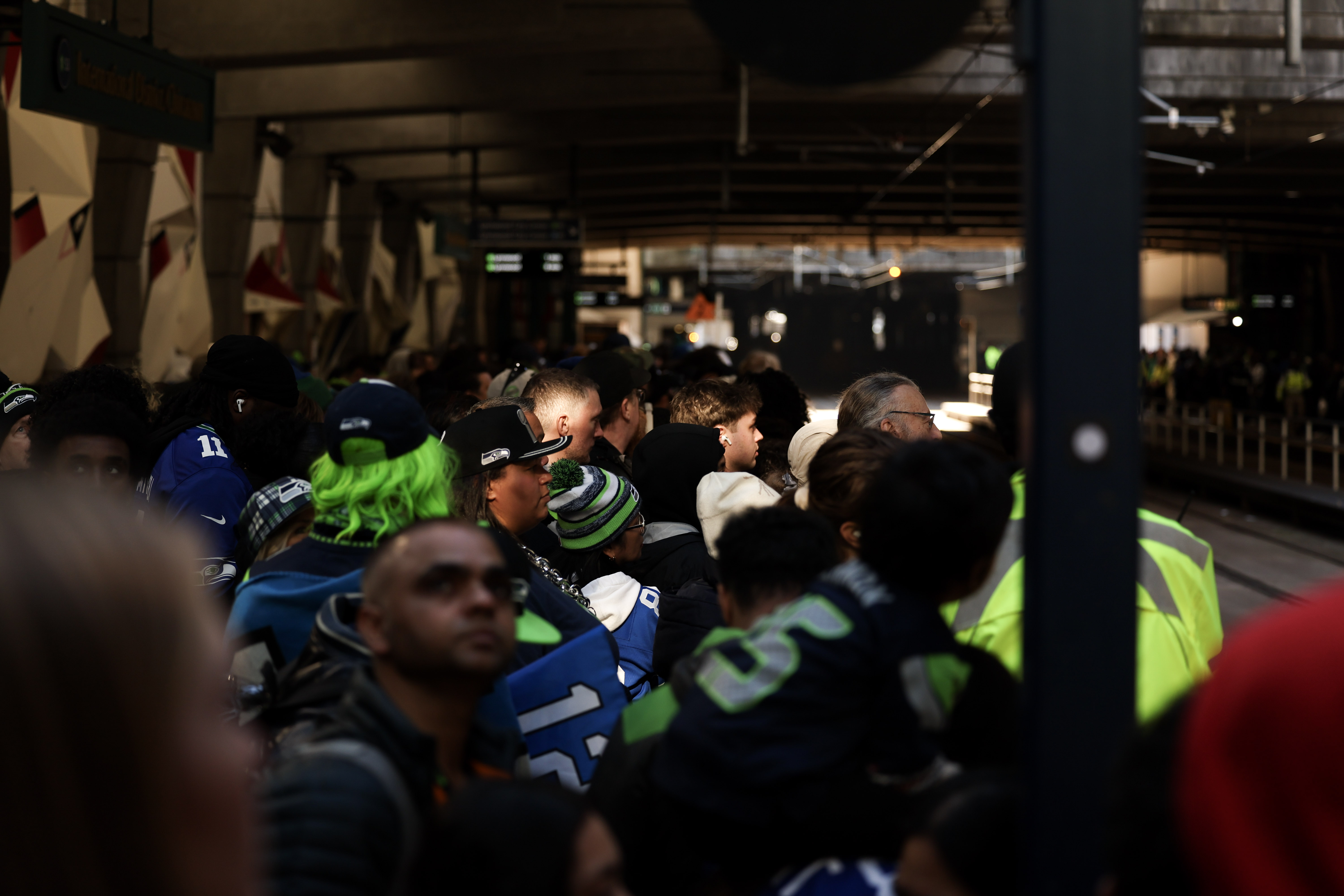 caption: Seattle Seahawks fans wait for the light rail at the King Street Station after the Super Bowl LX celebration on Wednesday, February 11, 2026.