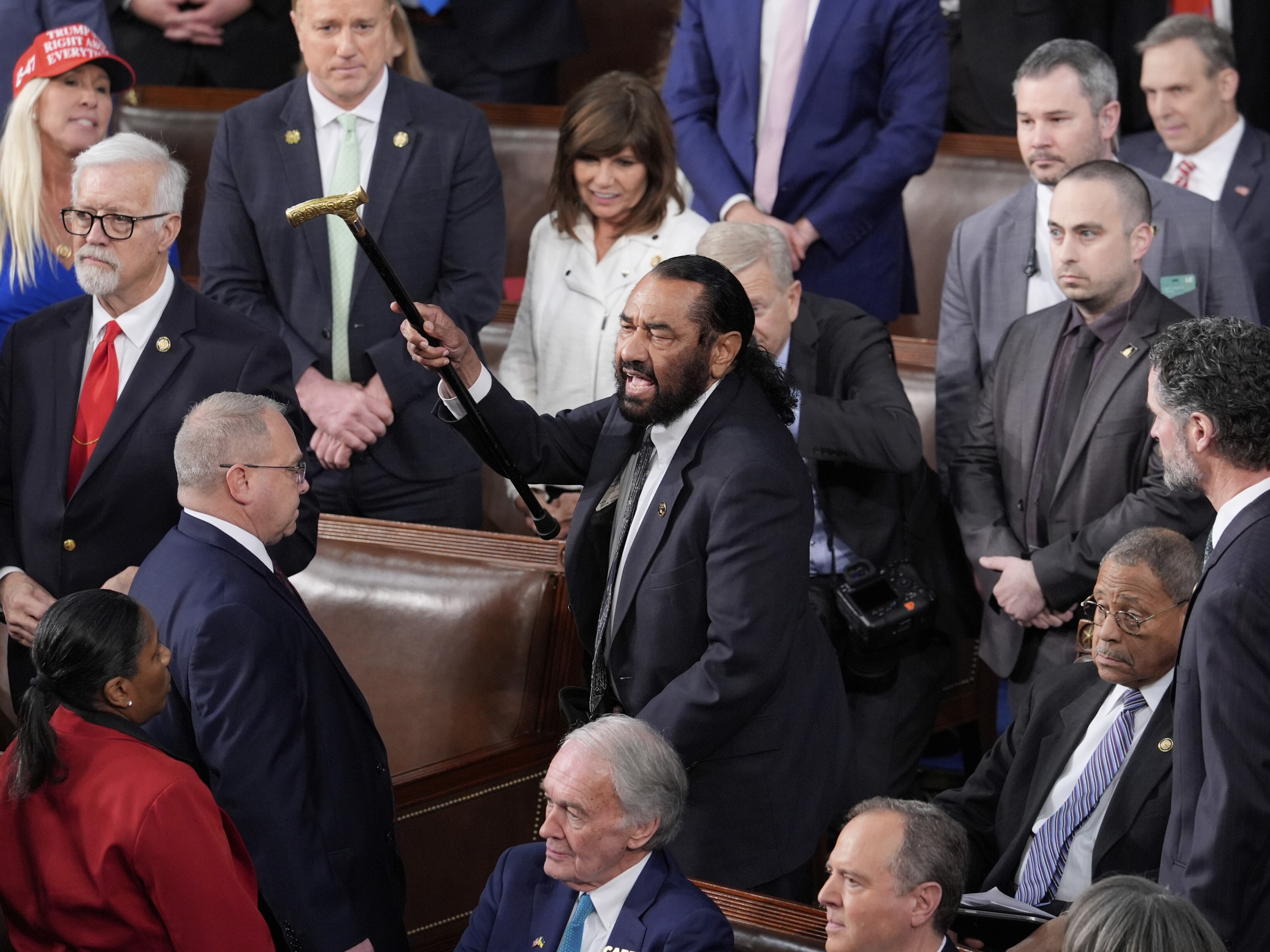caption: Rep. Al Greene, D-Texas, disrupts President Trump's address to a joint session of Congress at the Capitol in Washington on March 4.