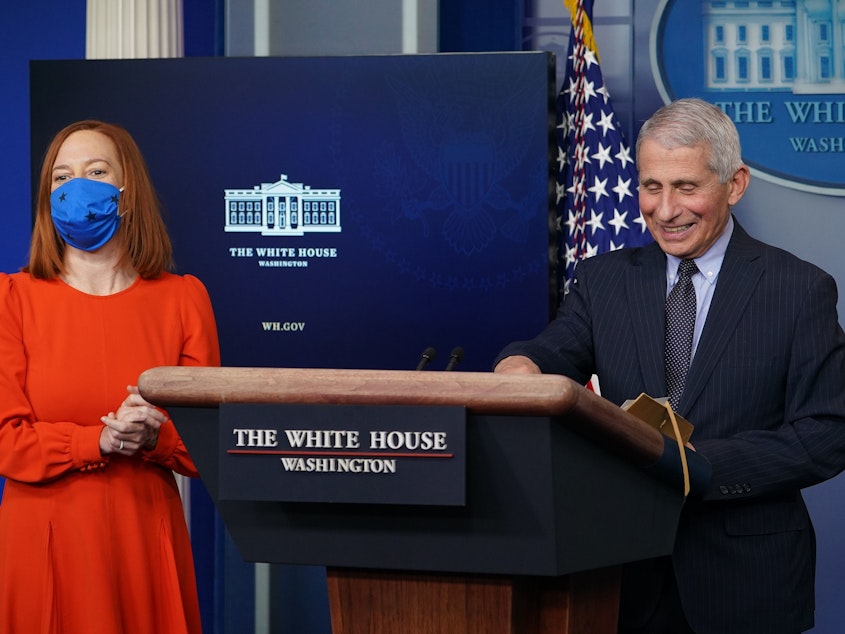 caption: Dr. Anthony Fauci and White House press secretary Jen Psaki face reporters Thursday during the daily White House briefing.