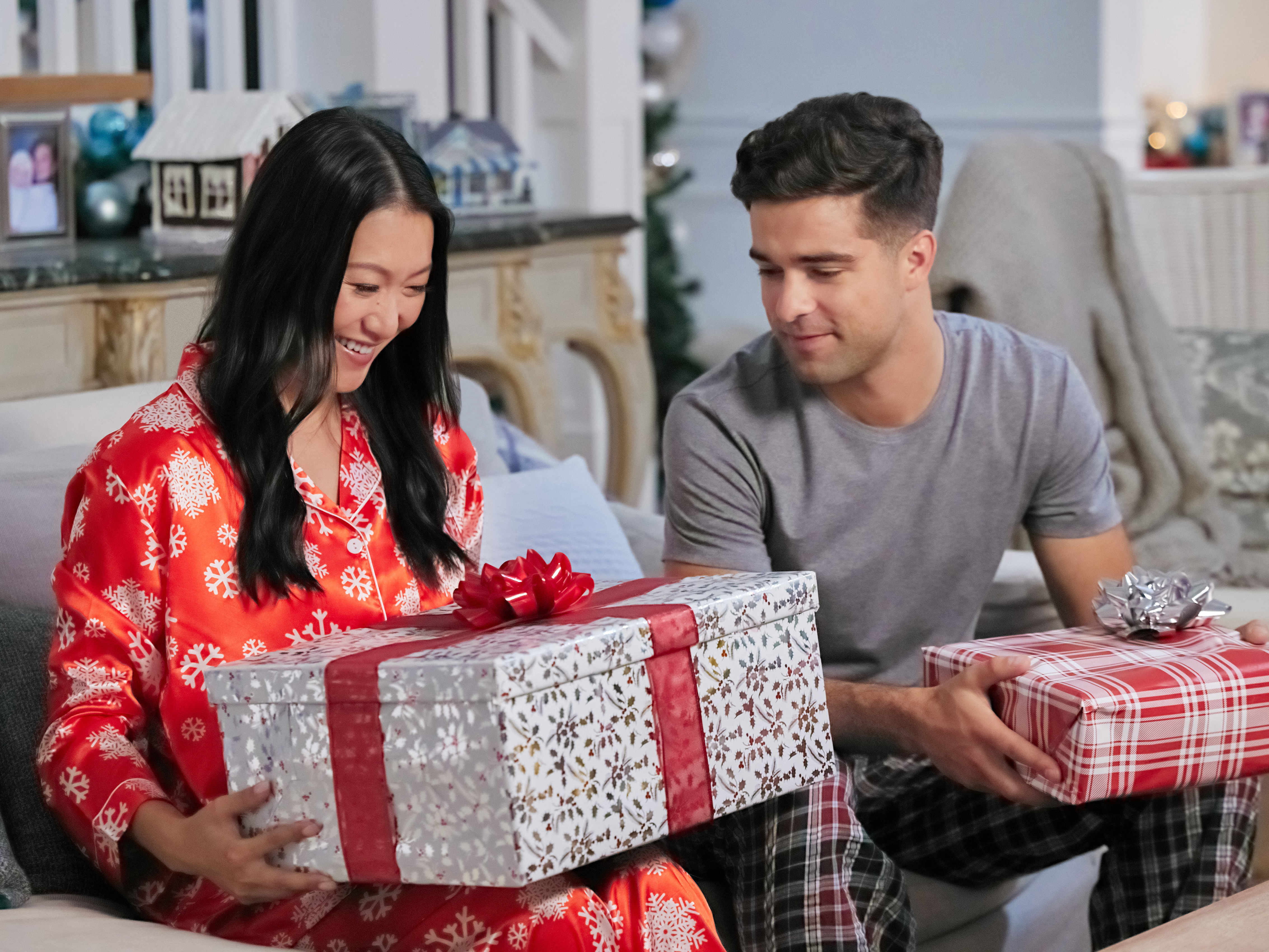caption: Kara Wang and Markian Tarasiuk in <em>Christmas at the Golden Dragon.</em>